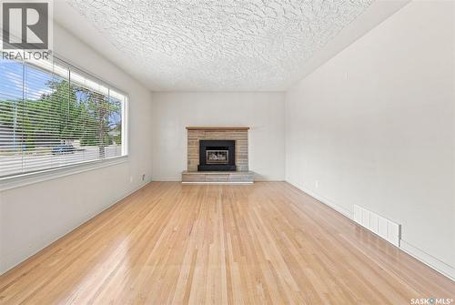 2409 York Avenue, Saskatoon, SK - Indoor Photo Showing Living Room With Fireplace