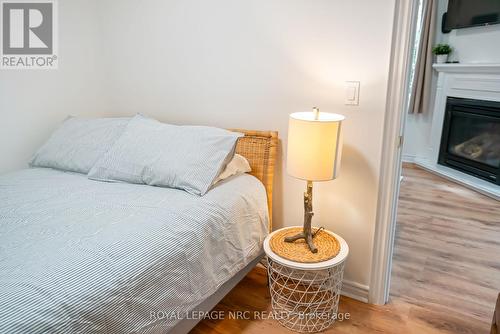 310 Eastwood Avenue, Fort Erie (Crystal Beach), ON - Indoor Photo Showing Bedroom With Fireplace