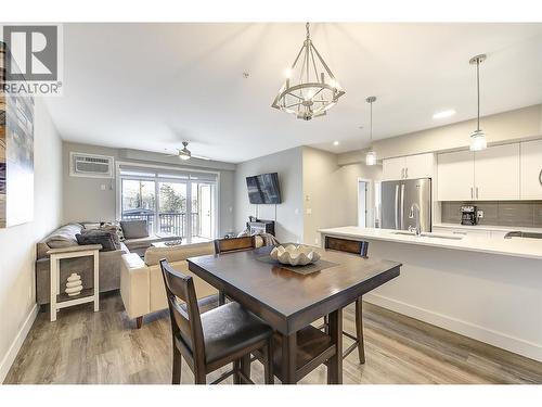 Dining room area will easily seat 6-9 people - 3090 Burtch Road Unit# 201, Kelowna, BC - Indoor Photo Showing Kitchen