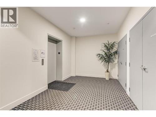Crisp inviting expansive hallways welcome you home. - 3090 Burtch Road Unit# 201, Kelowna, BC - Indoor Photo Showing Bathroom