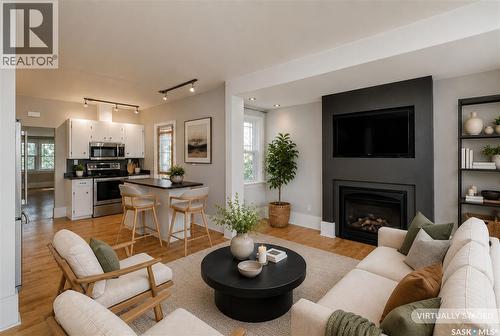 903 10Th Street E, Saskatoon, SK - Indoor Photo Showing Living Room With Fireplace