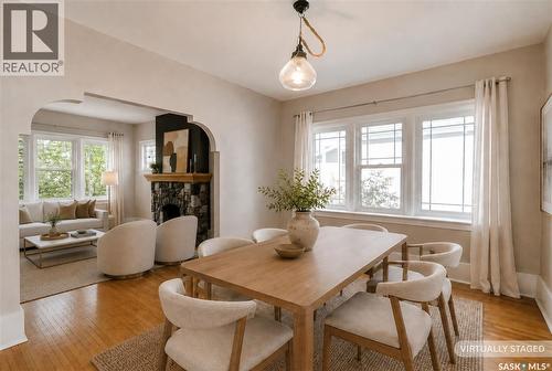 903 10Th Street E, Saskatoon, SK - Indoor Photo Showing Dining Room With Fireplace