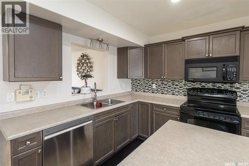483 Coad Manor, Saskatoon, SK - Indoor Photo Showing Kitchen With Double Sink