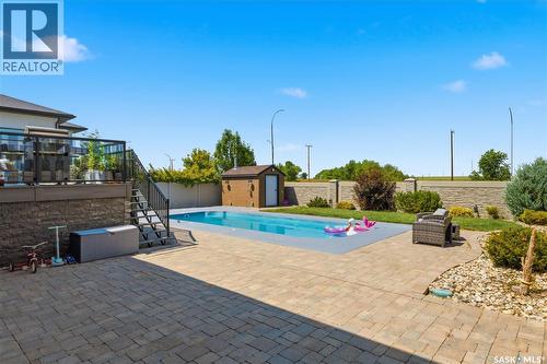 6024 Little Pine Loop, Regina, SK - Outdoor With In Ground Pool With Deck Patio Veranda