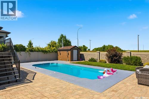 6024 Little Pine Loop, Regina, SK - Outdoor With In Ground Pool With Deck Patio Veranda