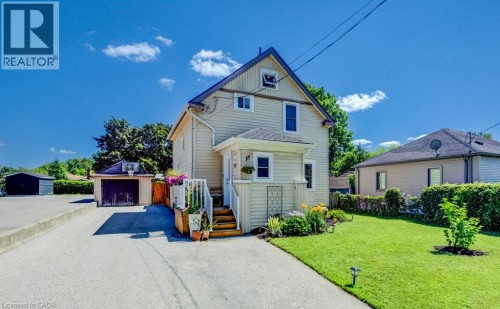 Classic two-story home with cream-colored exterior siding and gable roofline - 209 Belleview Avenue, Kitchener, ON - Outdoor