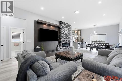 411 Schmeiser Bend, Saskatoon, SK - Indoor Photo Showing Living Room With Fireplace