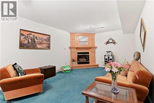 1030 Colborne Street E Unit# 19, Brantford, ON - Indoor Photo Showing Living Room With Fireplace