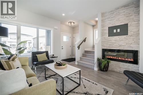 2964 Green Turtle Road, Regina, SK - Indoor Photo Showing Living Room With Fireplace