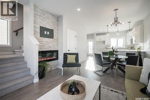 2964 Green Turtle Road, Regina, SK - Indoor Photo Showing Living Room With Fireplace