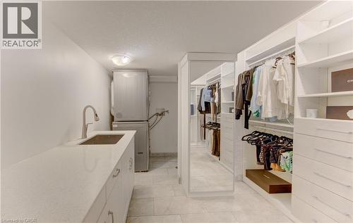 Custom closet system featuring extensive shelving and drawer storage - 106 Autumn Hill Crescent, Kitchener, ON - Indoor With Storage