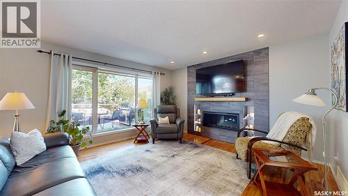 1619 Wingert Drive N, Regina, SK - Indoor Photo Showing Living Room With Fireplace