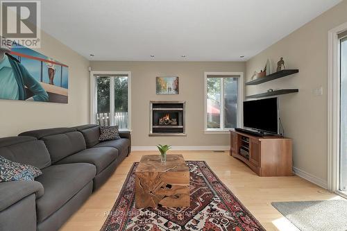 Living Room - 242 Deerfox Drive, Ottawa, ON - Indoor Photo Showing Living Room With Fireplace