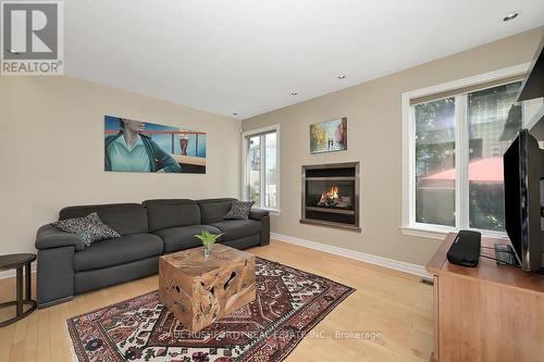 Living Room - 242 Deerfox Drive, Ottawa, ON - Indoor Photo Showing Living Room With Fireplace