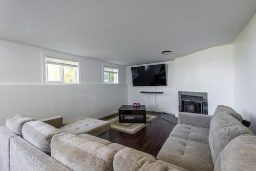 Salle familiale - 3013 Av. Bériot, Boisbriand, QC - Indoor Photo Showing Living Room With Fireplace