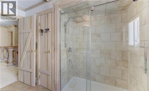 Glass-enclosed shower featuring subway tile surround, polished chrome fixtures, and a sliding door - 74 Forest Edge Trail, Kitchener, ON 
