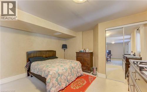 Bedroom featuring a mirrored closet, recessed lighting, and light-toned walls - 74 Forest Edge Trail, Kitchener, ON 