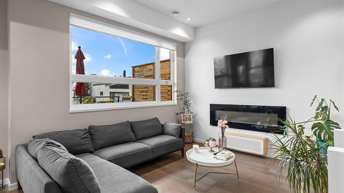 23-1818 Peak Point Court, West Kelowna, BC - Indoor Photo Showing Living Room With Fireplace