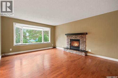 19 Thomson Avenue, Regina, SK - Indoor Photo Showing Living Room With Fireplace