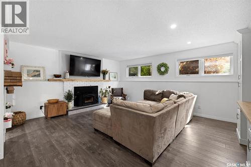 35 Ridgedale Bay, White City, SK - Indoor Photo Showing Living Room With Fireplace