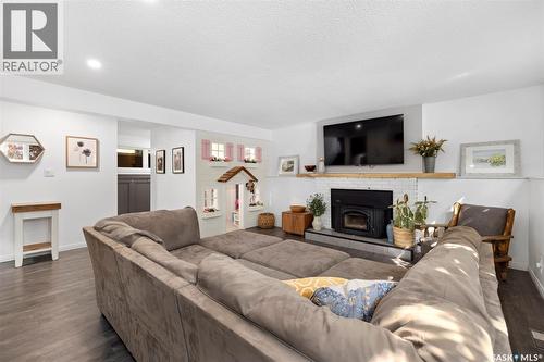 35 Ridgedale Bay, White City, SK - Indoor Photo Showing Living Room With Fireplace