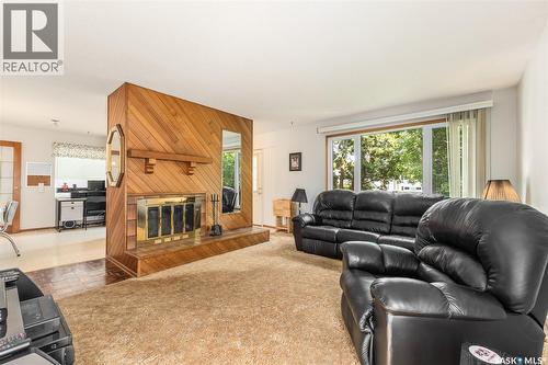 6142 7Th Avenue N, Regina, SK - Indoor Photo Showing Living Room With Fireplace