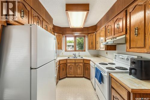 6142 7Th Avenue N, Regina, SK - Indoor Photo Showing Kitchen With Double Sink