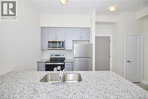 16 Concord Place Unit# 634, Grimsby, ON - Indoor Photo Showing Kitchen With Double Sink