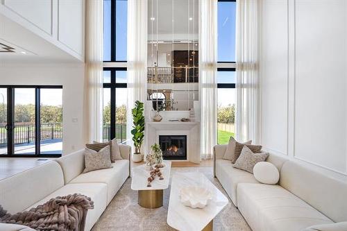 12 Ash Cove, Headingley, MB - Indoor Photo Showing Living Room With Fireplace