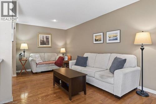 Hardwood flooring, recessed lighting, and neutral wall tones - 10 Cadham Boulevard Unit# 29, Hamilton, ON - Indoor Photo Showing Living Room