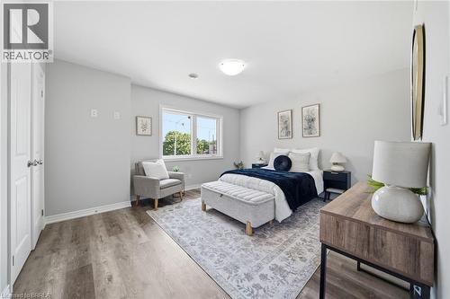 Wood-finish flooring, white walls, and a multi-pane window - 11 Ontario Street, Brantford, ON - Indoor