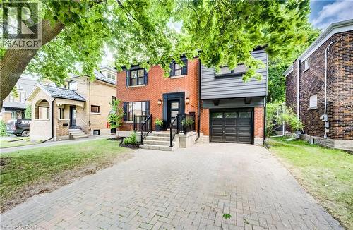Brick exterior with black trim windows - 34 Moore Avenue N, Waterloo, ON - Outdoor