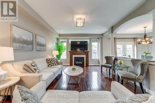 38 Assisi Street, Hamilton, ON - Indoor Photo Showing Living Room With Fireplace