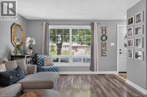 Bright, light-filled living space with expansive glass sliding doors and transom windows framing outdoor scenery - 60 Elford Crescent, Hamilton, ON - Indoor Photo Showing Living Room