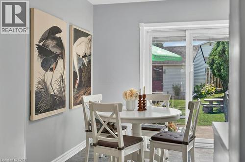 Sliding glass door, baseboard trim, and gray wall paint - 60 Elford Crescent, Hamilton, ON - Indoor Photo Showing Dining Room