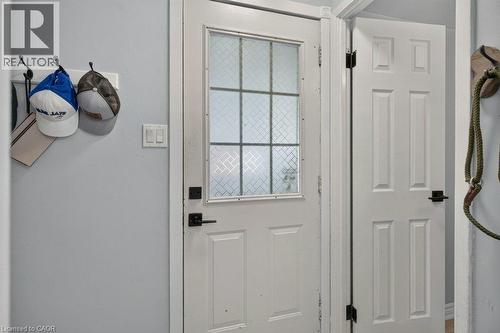 White paneled door with a decorative glass insert - 60 Elford Crescent, Hamilton, ON - Indoor Photo Showing Other Room