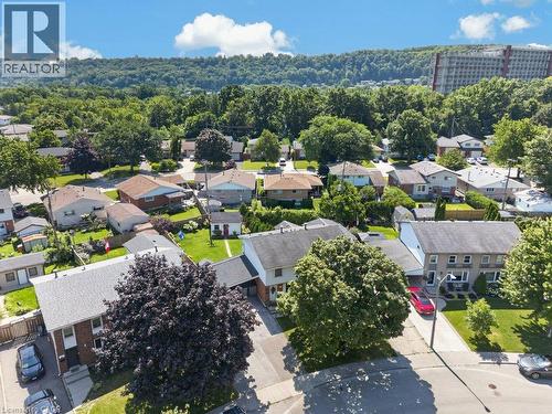 Aerial view showcasing a well-established residential neighborhood with mature tree-lined streets, generous lot sizes, and diverse single-family homes featuring varied architectural styles and rooflin - 60 Elford Crescent, Hamilton, ON - Outdoor With View
