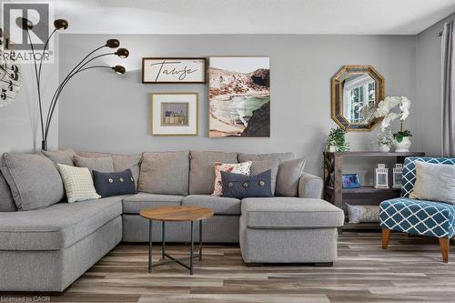 Wood-finish flooring throughout - 60 Elford Crescent, Hamilton, ON - Indoor Photo Showing Living Room