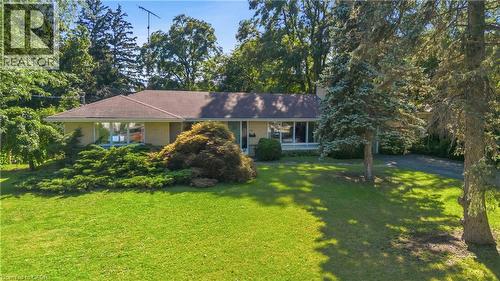Charming ranch home set on expansive grounds featuring a manicured lawn, mature specimen trees, and lush landscaping - 974 Unsworth Avenue, Burlington, ON 