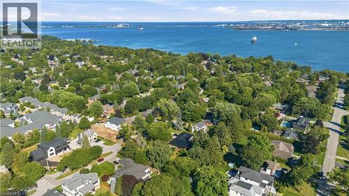 Aerial perspective showcasing this residential property nestled within a tree-lined neighborhood setting - 974 Unsworth Avenue, Burlington, ON 