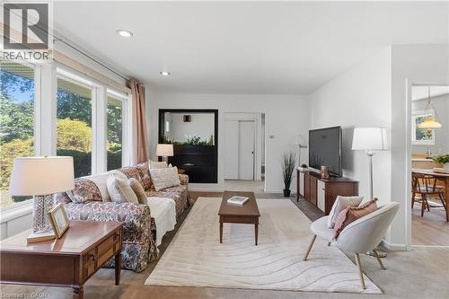 Living area featuring large picture windows, recessed lighting, neutral wall finishes, and carpet flooring - 974 Unsworth Avenue, Burlington, ON 