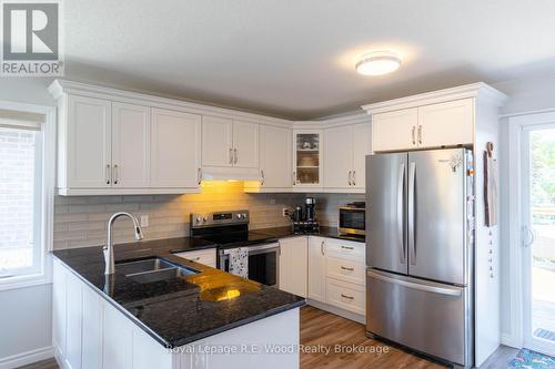 Updated appliances and granite counter tops - 87 Irving Drive, Norwich (Norwich Town), ON - Indoor Photo Showing Kitchen With Double Sink With Upgraded Kitchen