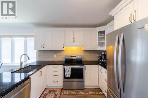 Updated appliances and granite counter tops - 87 Irving Drive, Norwich (Norwich Town), ON - Indoor Photo Showing Kitchen With Double Sink With Upgraded Kitchen