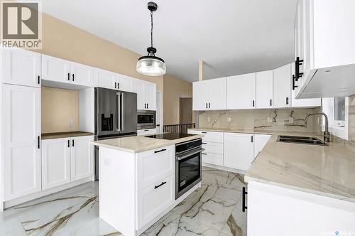 303 Haslam Crescent, Saskatoon, SK - Indoor Photo Showing Kitchen With Stainless Steel Kitchen With Double Sink