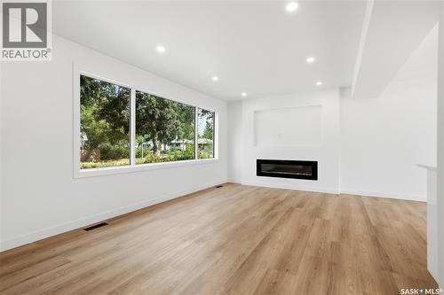 3638 Argyle Road, Regina, SK - Indoor Photo Showing Living Room With Fireplace