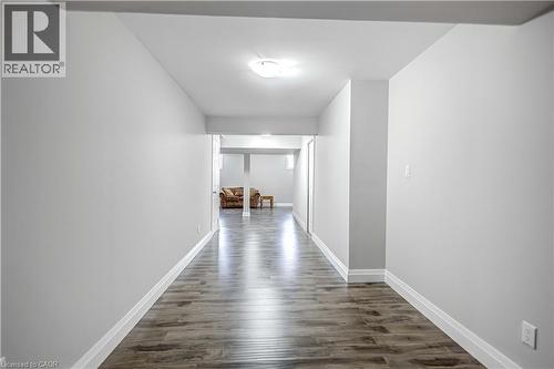 Hallway featuring dark wood-type flooring and baseboards - 8 Brantdale Avenue, Hamilton, ON - Indoor Photo Showing Other Room