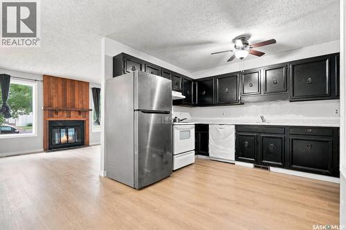 1718 Mckercher Drive, Saskatoon, SK - Indoor Photo Showing Kitchen With Fireplace