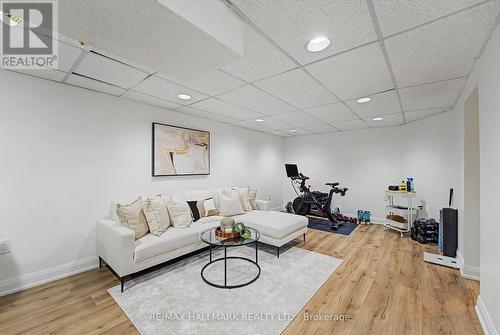 Large Rec Room vinyl floors bsmt - 117 Clappison Boulevard, Toronto, ON - Indoor Photo Showing Living Room