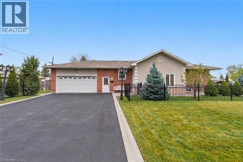 Brick and stucco exterior with an attached two-car garage - 197 Troy Street, Mississauga, ON - Outdoor