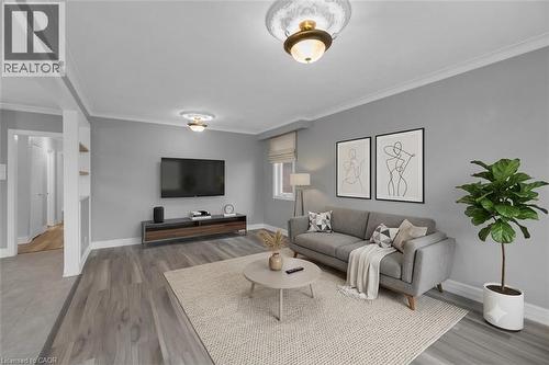 (ai staged) Living area featuring wood-finish flooring, light gray wall paint, and white crown molding - 197 Troy Street, Mississauga, ON - Indoor Photo Showing Living Room